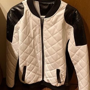 A leather white and black biker jacket